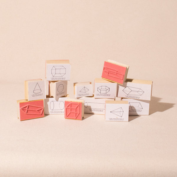 13 wood rubber stamps with imprints of 3d shapes