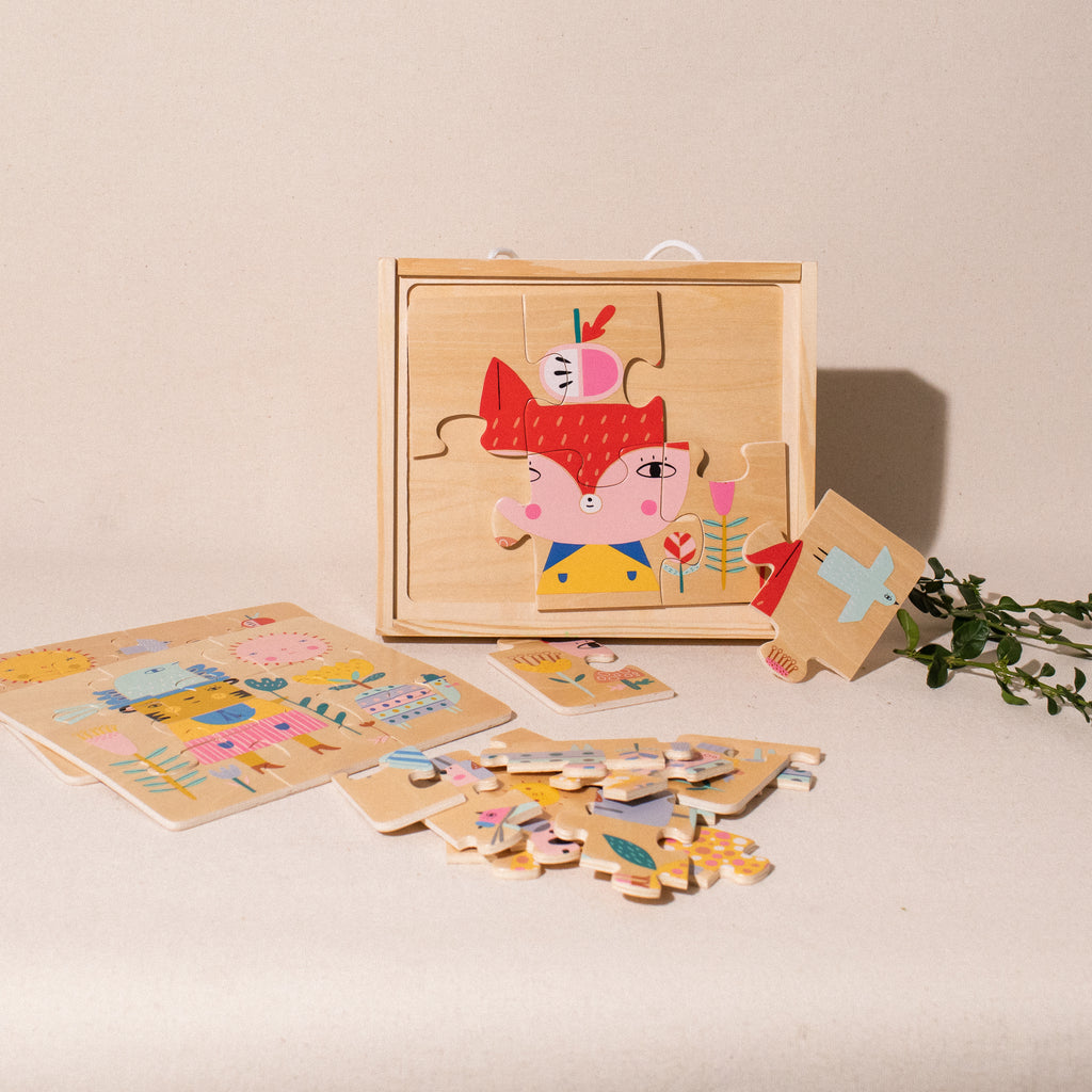 4 wooden animal puzzles in a wooden box