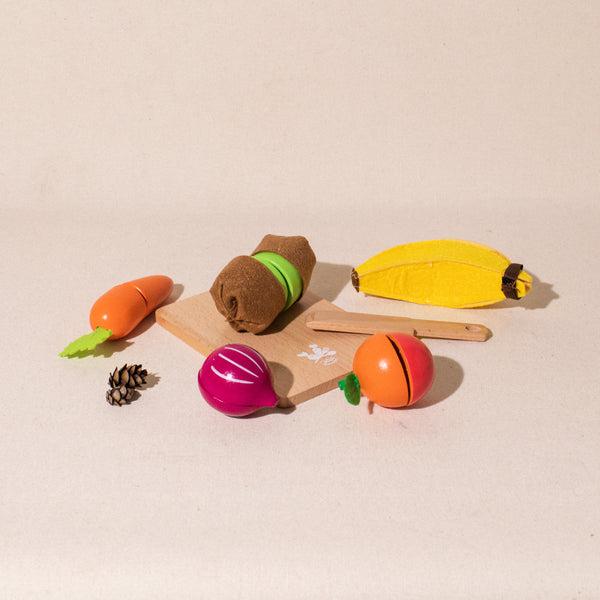 set of wood and fabric fruits and vegetables that can be cut, wooden knife and cutting board