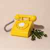 retro yellow wooden rotary phone