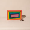 nested wooden rectangle blocks in rainbow colours