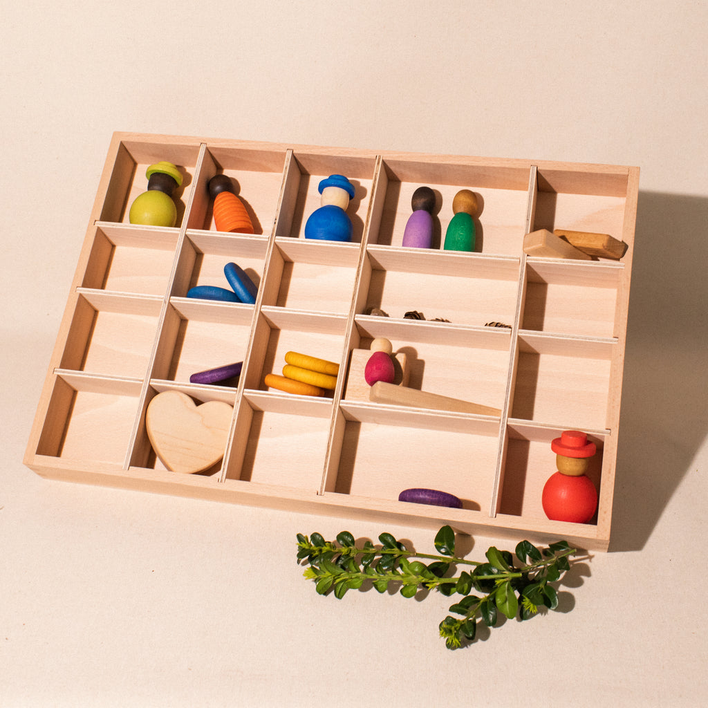 wooden tray with 20 compartments and various loose parts materials