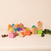 wooden houses and cubes of different sizes and colours by Ocamora