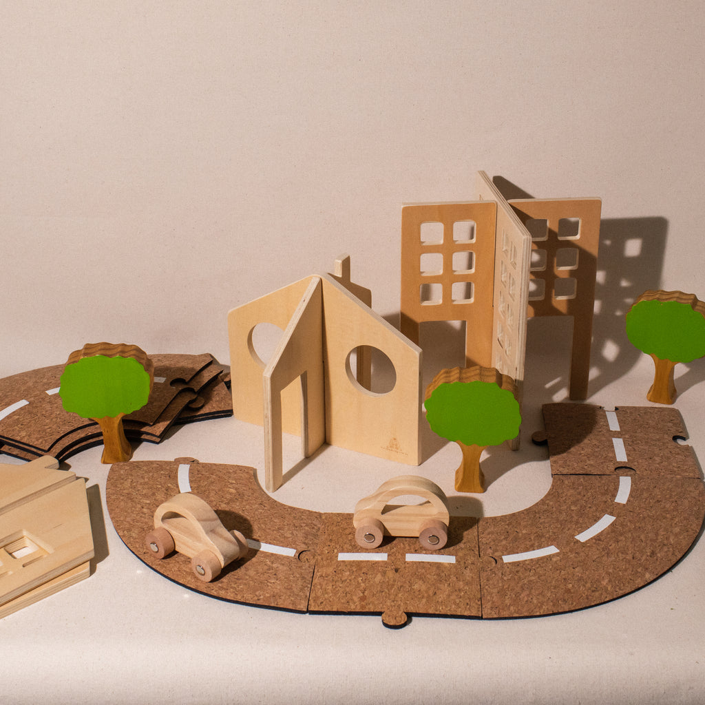 Getting About Town assembled building pieces and trees with cork roadway and 2 wooden cars