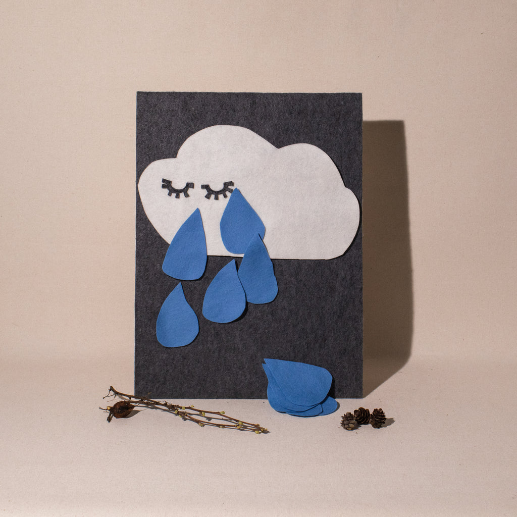 feltboard cloud with "eyes" and 10 blue felt raindrops