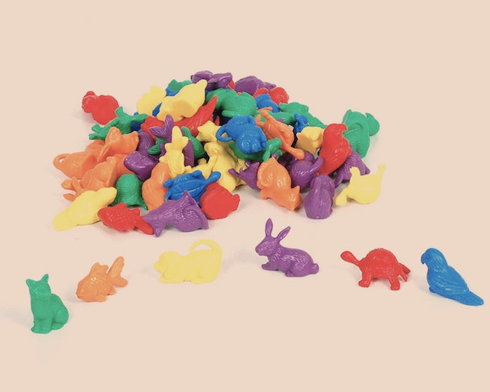 rainbow coloured pet counters in a pile cat fish puppy rabbit turtle parrot