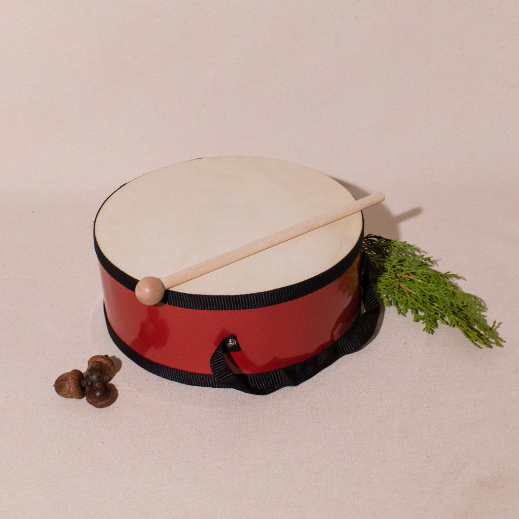 Tom tom drum with strap and mallet