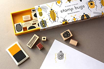 stamp bugs box set showing yellos and gray ink pad, mulitple insect stampms and a paper with stamped bug