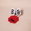 butterfly shaped crinkle fabric on wooden teether ring